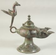 A SEJUK KHORASAN OPENWORKED BRONZE TWIN-SPOUTED OIL LAMP, the handle with bird finial, 25cm long (