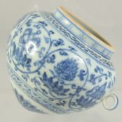 A CHINESE BLUE AND WHITE PORCELAIN BIRD FEEDER, with lucky symbols and lotus decoration, 7cm x 8cm.