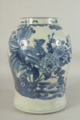 A LARGE CHINESE REPUBLIC PERIOD BLUE AND WHITE JAR, painted with exotic bird and native flora, (