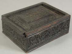 A 19TH CENTURY INDIAN CARVED WOODEN BOX, 11cm x 8.5cm.