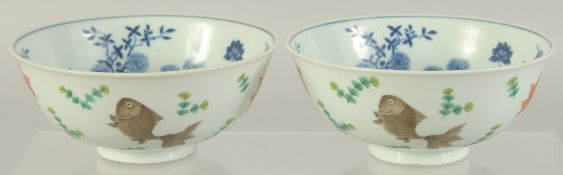 A PAIR OF CHINESE FAMILLE ROSE PORCELAIN BOWLS, the exterior painted with coral red fish, the