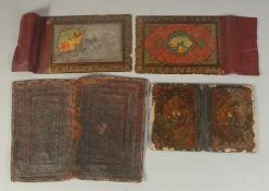 A COLLECTION OF THREE PERSIAN QAJAR BINDINGS, each with miniature painting to the cover, together