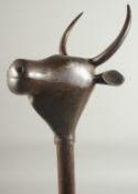 A PERSIAN CEREMONIAL BULL HEAD MACE, 80cm long.