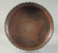 A LARGE PERSIAN SAFAVID ENGRAVED COPPER BOWL, the centre with bands of decorative motifs, 41.5cm