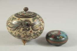 A 19TH CENTURY CLOISONNE LIDDED BOX, beautifully decorated with exotic birds and flora, raised on