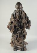 A LARGE NATURALISTIC ROOT WOOD CARVING OF SHOU LAO, 73cm high.