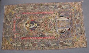 A 20TH CENTURY IRANIAN TABRIZ OR YAZD, densely woven with floral and foliate scrolls, figures and