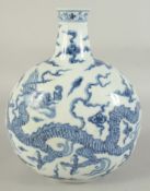 A CHINESE BLUE AND WHITE PORCELAIN DRAGON MOON FLASK VASE, 29cm high.