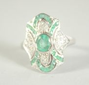 A 9CT. GOLD EMERALD AND DIAMOND DECO STYLE RING.