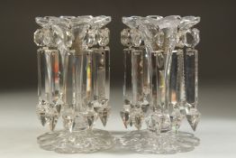 A LARGE PAIR OF 19TH CENTURY CUT GLASS LUSTRES with prism drops and shaped bases. 8ins high along