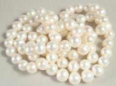 A ROPE OF FRESHWATER PEARLS, approx. 33ins long, pearls approx. 10 - 11mm diameter.