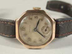 A LADIES VINTAGE GOLD ROLEX WRIST WATCH with leather strap.