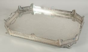 A GOOD ENGRAVED AND SILVER PLATED TWO HANDLED SERVING TRAY with pierced gallery on four curving