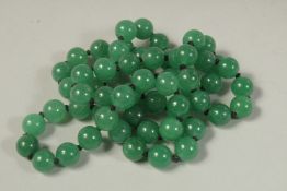 A STRING OF SIXTY BEADS. 26ins long.