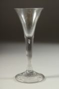 AN 18TH CENTURY ENGLISH WINE GLASS with tapering bowl. 6.5ins high.