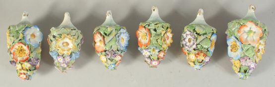 A LARGE PAIR OF MEISSEN PORCELAIN FLOWER ENCRUSTED TREE DECORATIONS, 4.5ins long, and four small