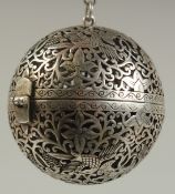 A CHINESE BALL CENSER. 2ins diameter on a chain.