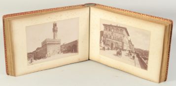 A BOUND LEATHER PHOTOGRAPH ALBUM OF ITALIAN SCENES.