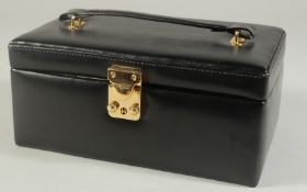 A BLACK LEATHER JEWELLERY CASE. 8.5ins x 6ins.