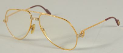 A CARTIER, PARIS, GOLD SPECTACLES, stamped, Cartier, Paris, 57 20, in a leather case.