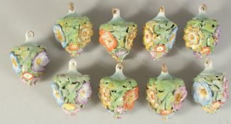 A GOOD SET OF NINE MEISSEN PORCELAIN FLOWER ENCRUSTED TREE DECORATIONS. 2.75ins long.
