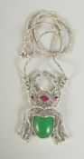 A SILVER AND JADE SCARAB PENDANT AND CHAIN.