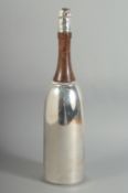 A SILVER PLATED AND WOOD CHAMPAGNE BOTTLE COCKTAIL SHAKER.