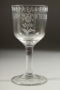A LARGE 18TH CENTURY GLASS GOBLET, engraved 