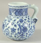 A CHINESE BLUE AND WHITE PORCELAIN JUG. 14 cm high.