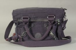 A KIPLING BLUE ALL PURPOSE BAG AND PURSE. 12ins long.