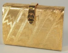 A MAN GIAMULI OF MILANO, ITALY GILT METAL EVENING BAG. 5.5ins long, with long gilt strap, 16ins