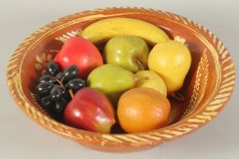 A SLIPWASH CIRCULAR BOWL, 13ins diameter and NINE VARIOUS WAX FRUITS.