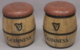 A PAIR OF LEATHER TOP GUINNESS BARREL SEATS.
