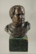 A SMALL BRONZE ROMAN BUST. 3.5ins on a marble base.