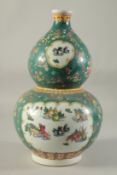 A CHINESE DOUBLE GOURD VASE painted with fish. 15ins high.