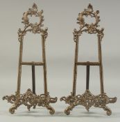 A PAIR OF BRONZED EASELS. 16ins high.