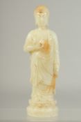 A CHINESE WHITE JADE CARVED FIGURE. 7.5ins high.