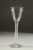 AN 18TH CENTURY ENGLISH WINE GLASS with inverted bowl and air twist stem. 6ins high.