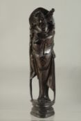 A CHINESE CARVED AND INLAID WOODEN FIGURE. 11ins high.
