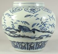 A LARGE CHINESE BLUE AND WHITE PORCELAIN JAR decorated with birds and flora. 30cm high.