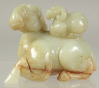 A CHINESE CARVED JADE RAM AND YOUNG. 2.25ins
