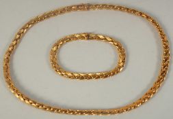 A .750 GOLD CHAIN, 15.5ins long and a matching BRACELET, 7ins long, 57gms.