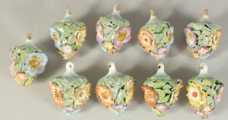 A GOOD SET OF NINE MEISSEN PORCELAIN FLOWER ENCRUSTED TREE DECORATIONS. 2.75ins long.