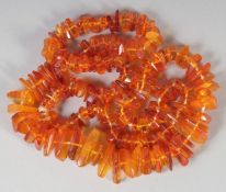 A GOOD FACETED AMBER GRADUATED NECKLACE, 120 beads, 30ins long, 84gms.