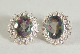 A PAIR OF 9CT GOLD MYSTIC TOPAZ AND DIAMOND EARRINGS.