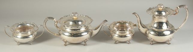 A VERY GOOD FOUR PIECE SILVER CIRCULAR TEA SET of pie crust design with shell mounts, comprising: