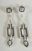 A PAIR OF SILVER ART DECO STYLE LONG DROP EARRINGS.