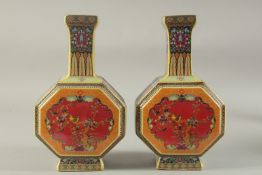 A PAIR OF CHINESE PORCELAIN OCTAGONAL VASES painted with birds. 10ins high.