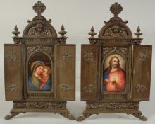 A GOOD PAIR OF BRASS FOLDING ICONS with continental oval porcelain panels, Christ and Madonna and