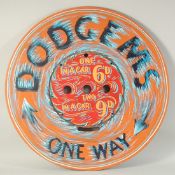 A PAINTED ROUND FAIRGROUND SIGN 